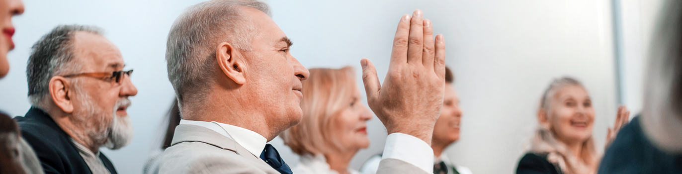 Seniors at a seminar applauding