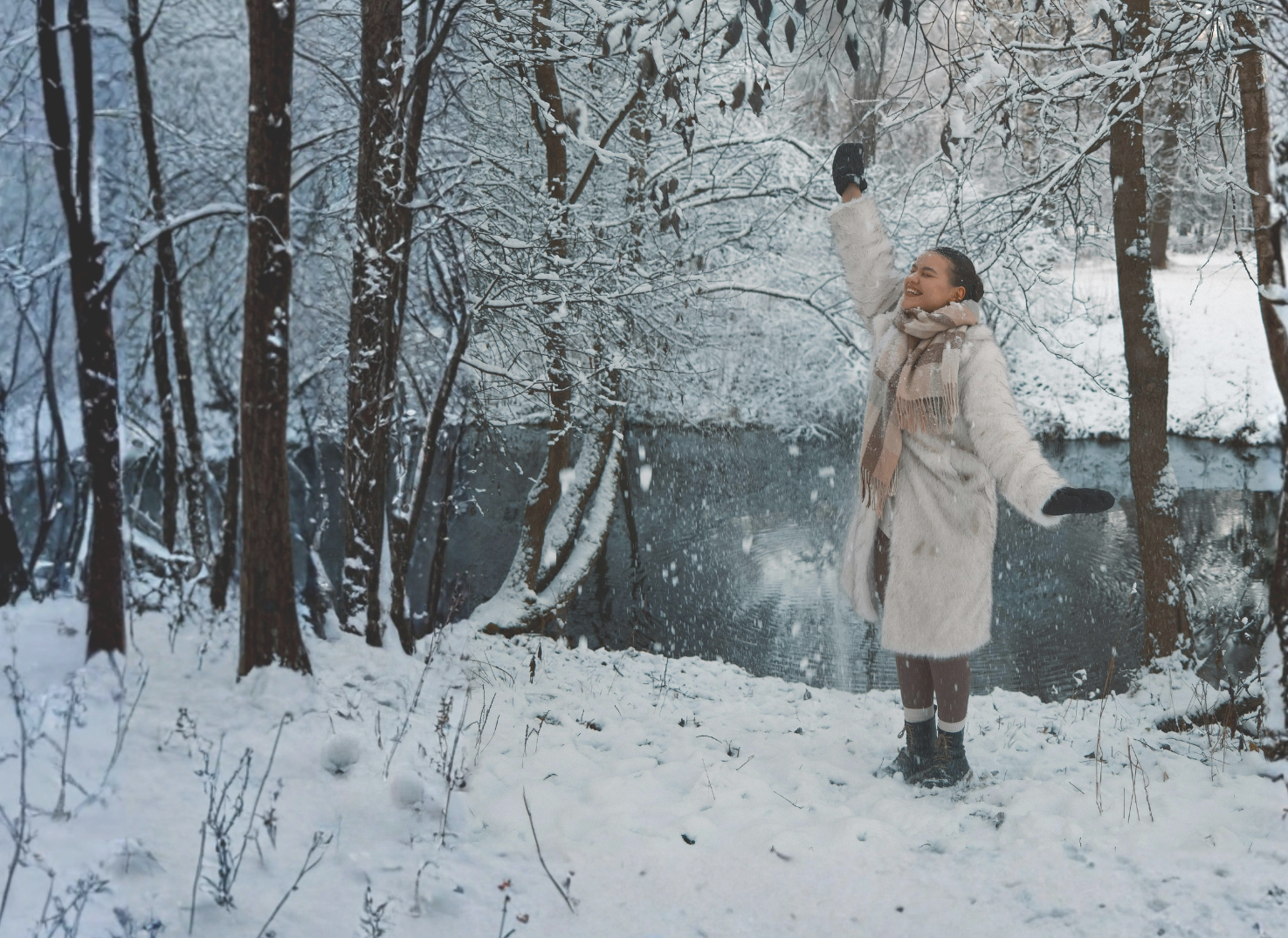 happy woman in snowy forest
